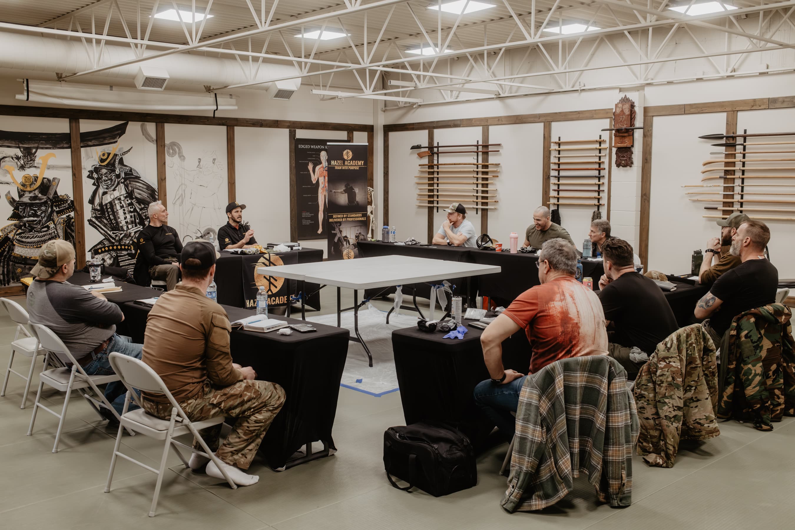 Instructor coaching students through a tactical medicine drill